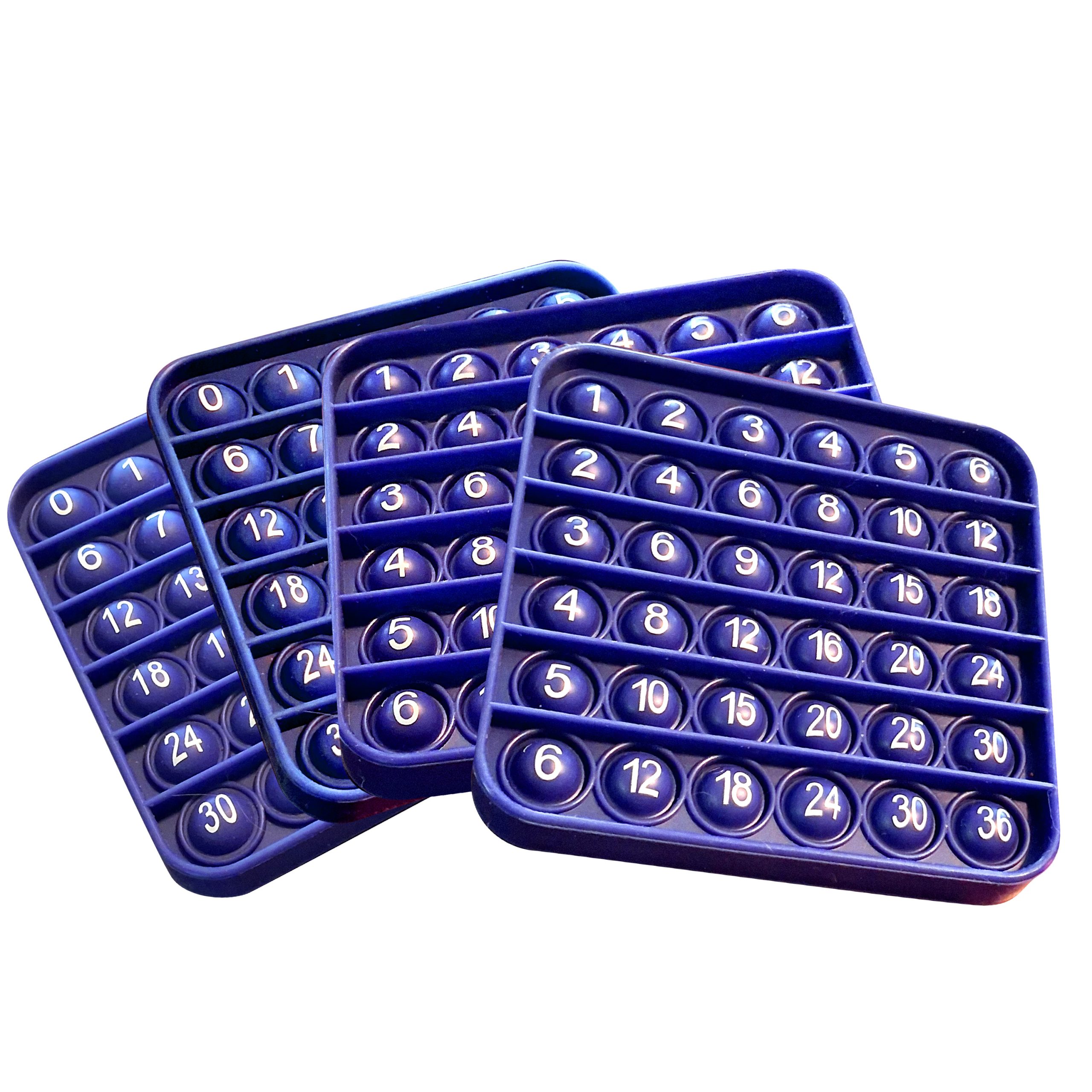 Four reusable ArithMatrix silicone math game pop mats